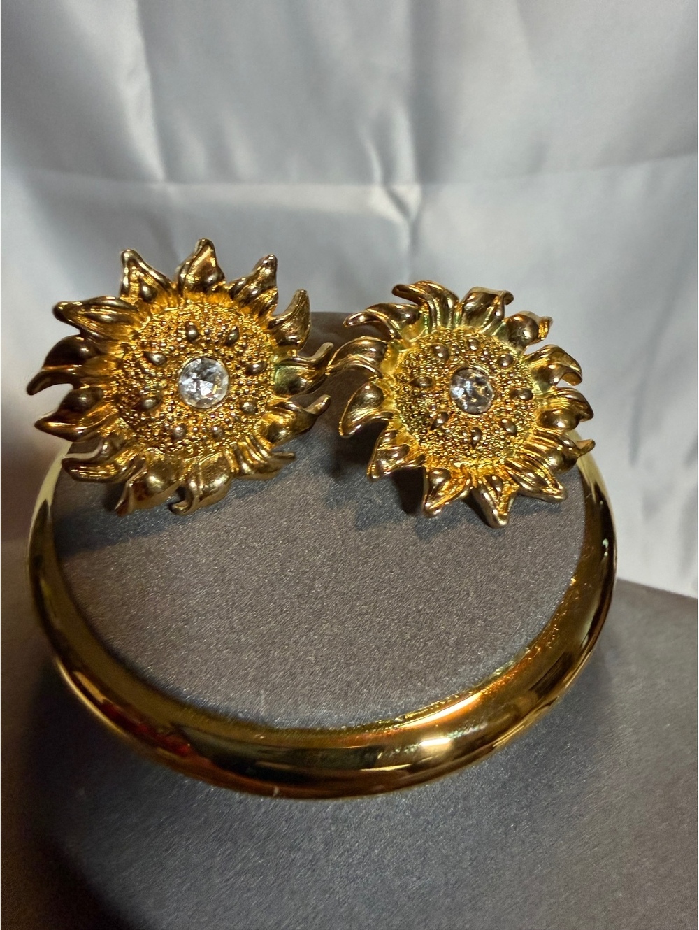 Gold tone sunflower rhinestone stud earrings